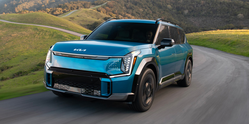 A 2025 Kia EV9 driving down the backroads in Medina, OH