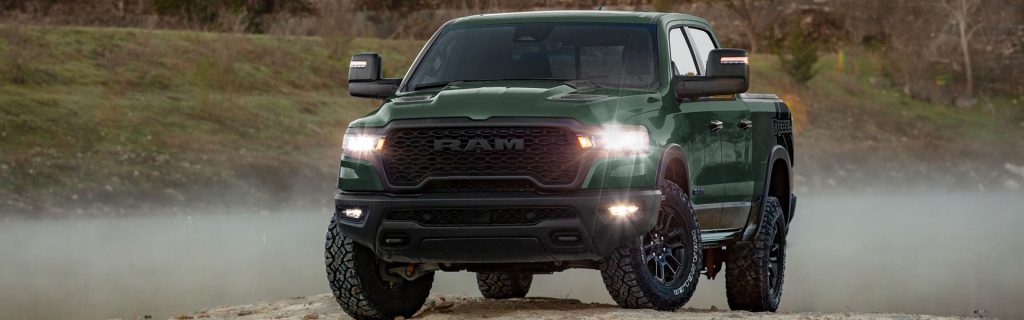 2026 Ram 1500 Rebel off-road pickup truck in action, highlighting powerful performance, durable design, advanced 4x4 capability, and versatile utility for work and adventure.
